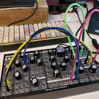 The Pittburgh Modular SV-1B semi modular synth, patched with colorful cables