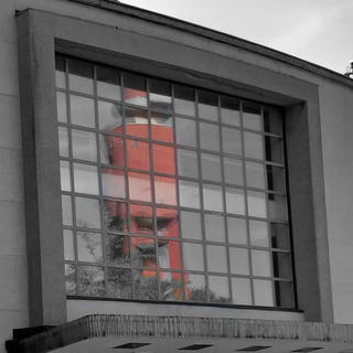 A photograph of the lighthouse in Hanko (Finland), as reflected in a window